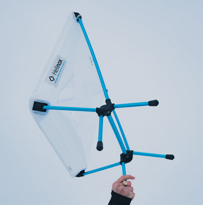 A man lifting Helinox Zero Chair